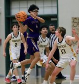 Lemoore's Kyle Kibiling drives between a crowd of Sierra Pacific defenders in the second half of Lemoore's loss.